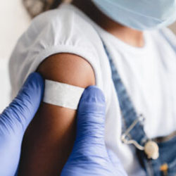 A doctor administering a vaccination