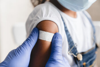 A doctor administering a vaccination