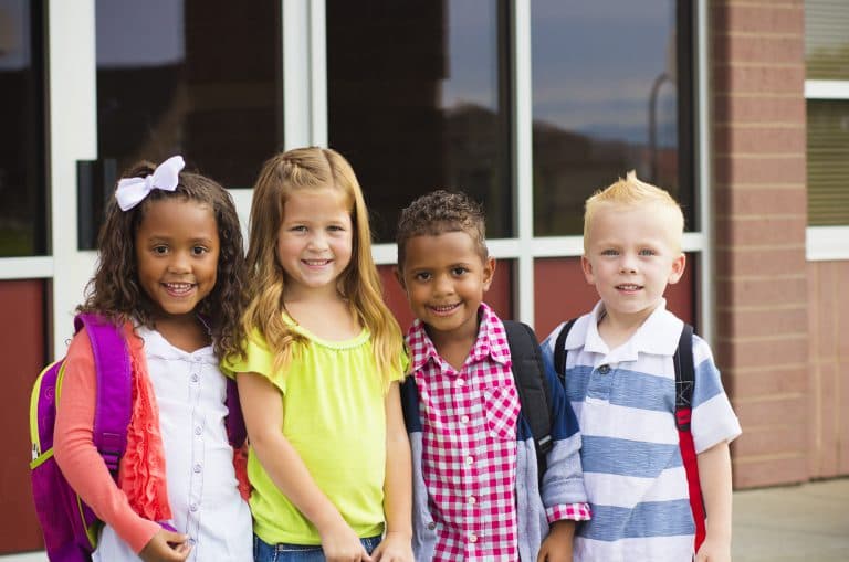 Kids pose for a picture on the first day of school.