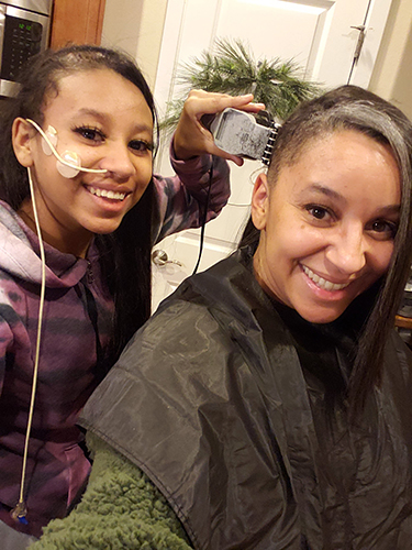 When Maleea and Malachi needed part of their heads shaved for surgery, Sabrina shaved hers, too.