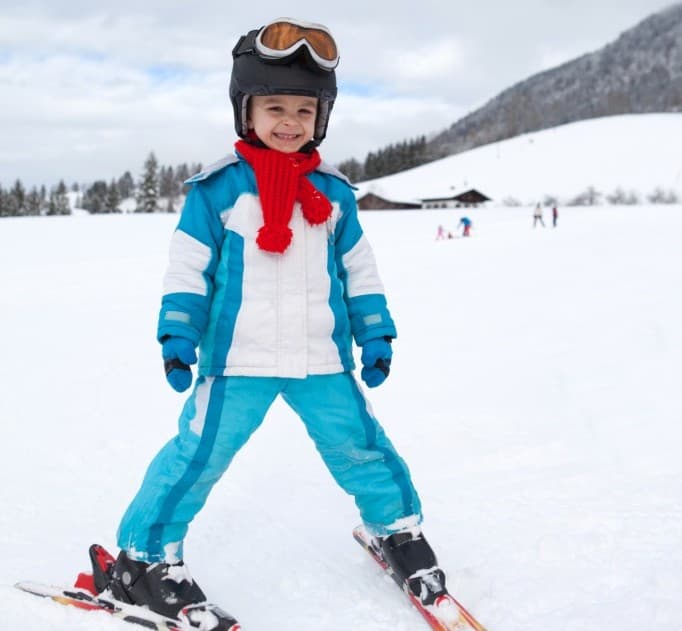 Girl learning to ski safely.