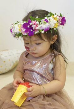 A baby in a flower crown