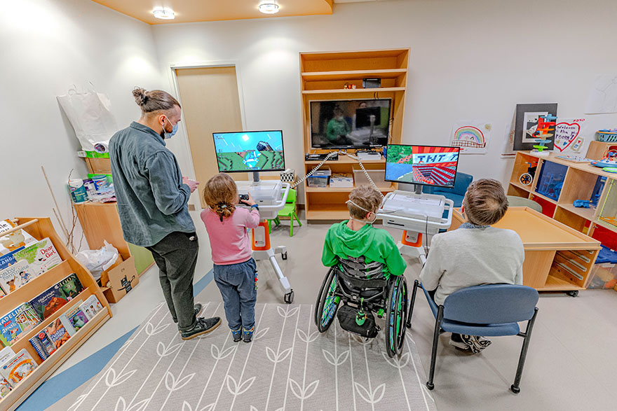 Therapeutic Gaming Specialists Forest Coyle and Max Williams play Minecraft with Seattle Children’s patients