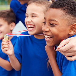 Children holding medals