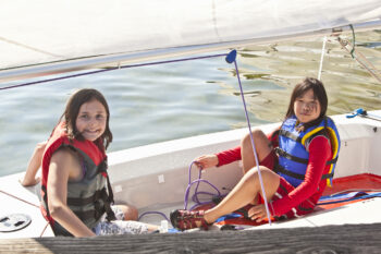 Girls sit in a boat