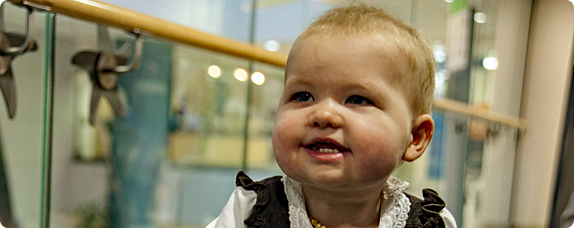 A toddler takes a walk around the hospital