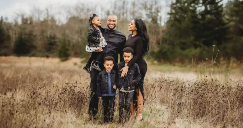 A family stands in a field