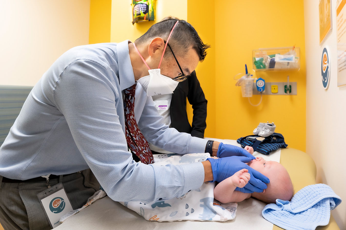 A Seattle Children's provider examines a baby