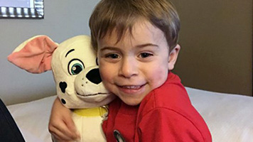 A boy with a stuffed animal