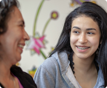 Kiddo laughing with mom