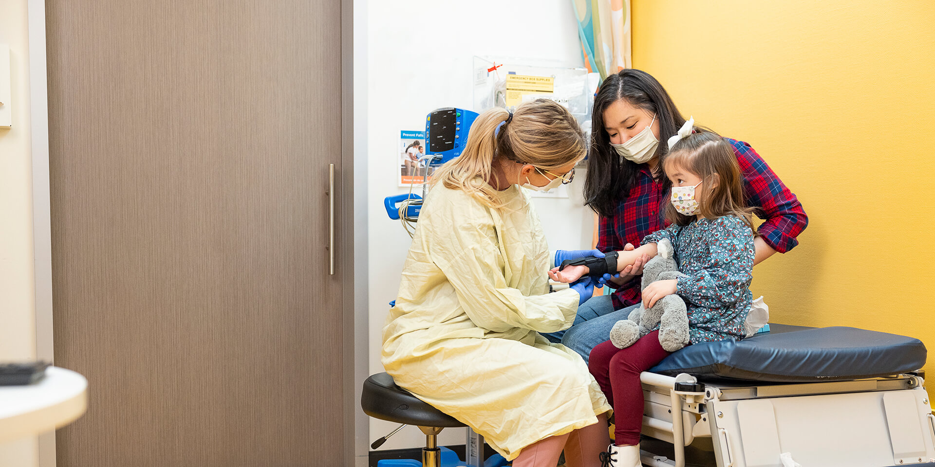 A mother and daughter with a provider at Urgent Care at Seattle Children's