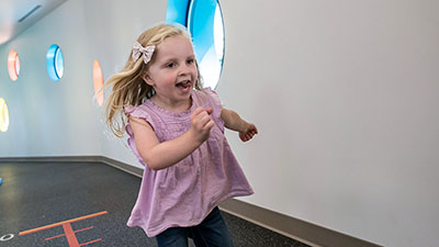 A girl runs at Seattle Children's