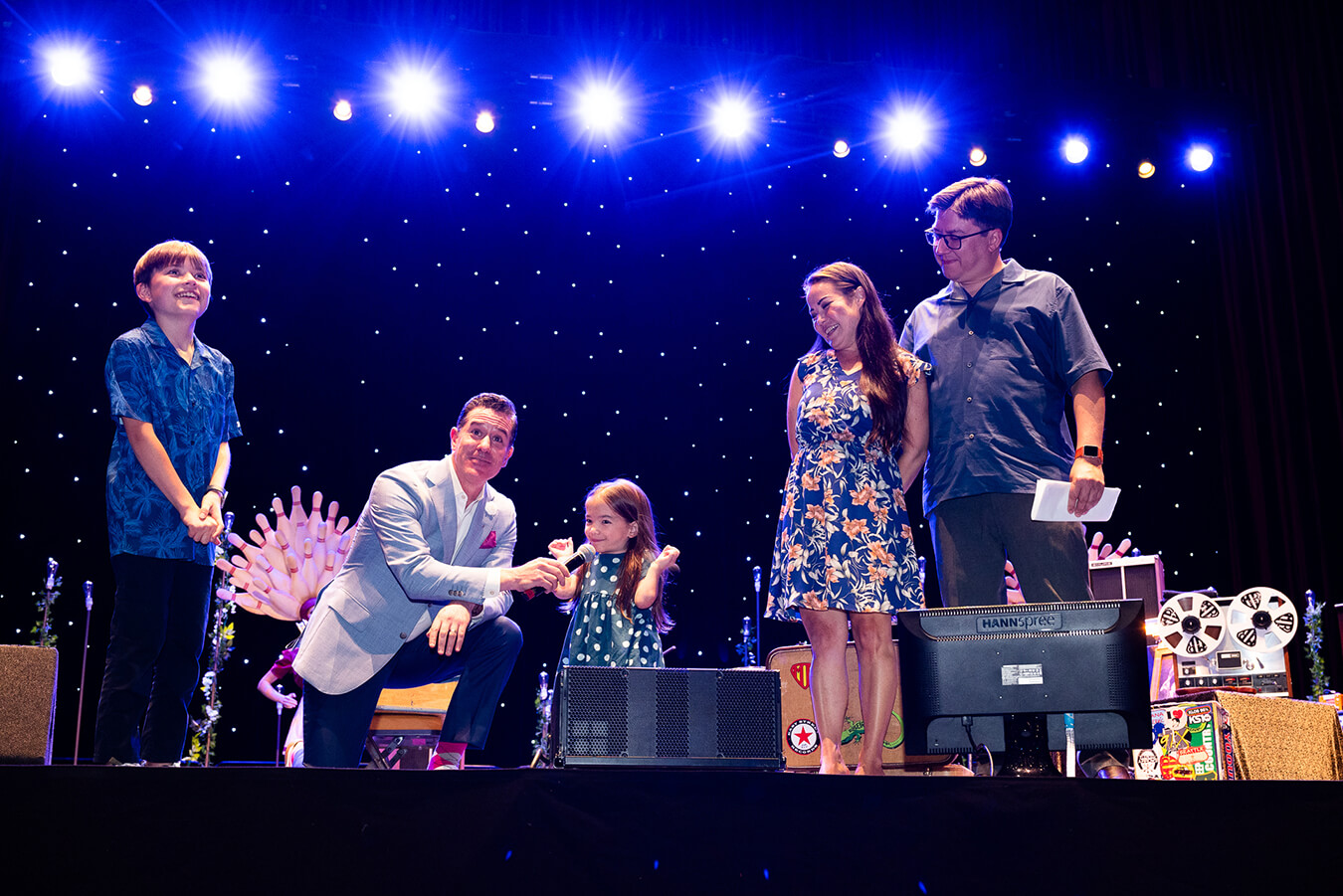 Hailee and family onstage at fundraising event