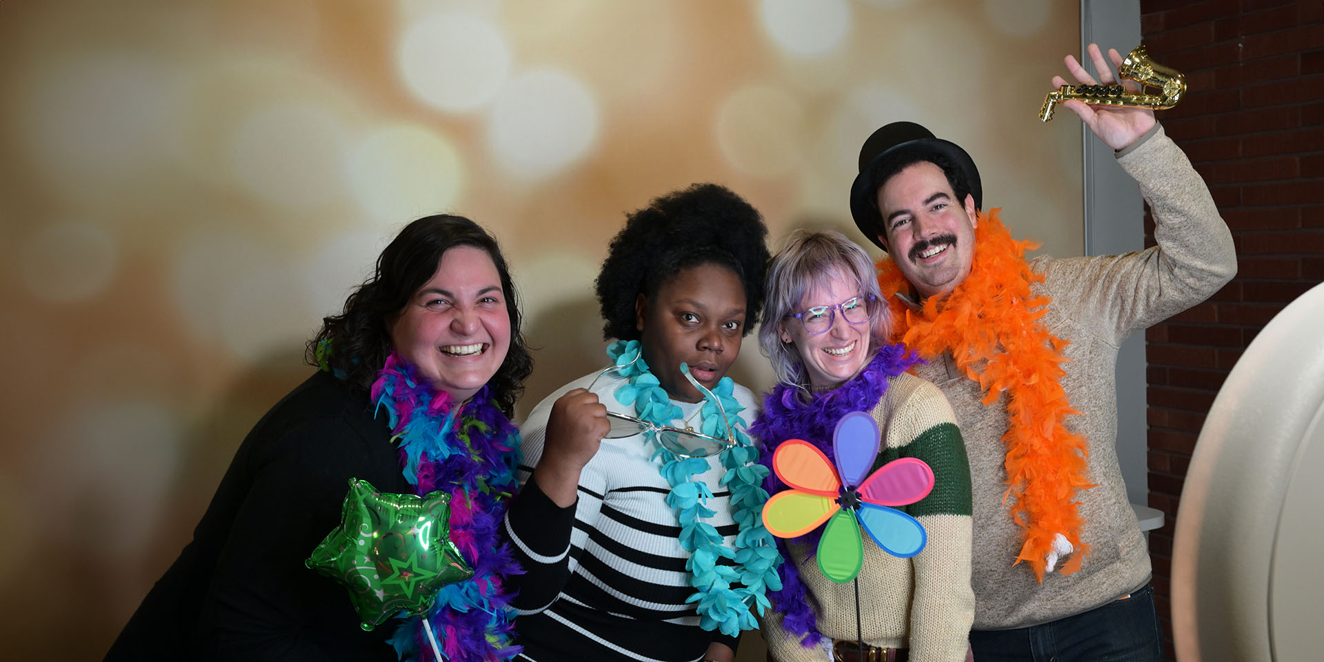 Four people celebrating at a fundraiser