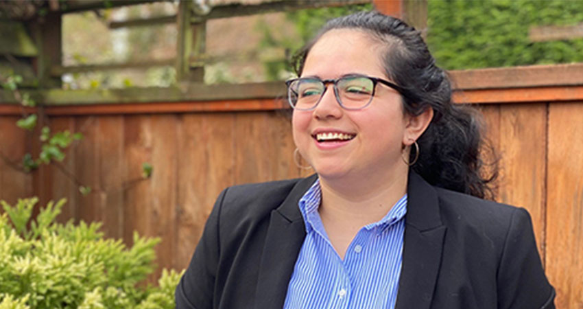 A young woman wearing glasses