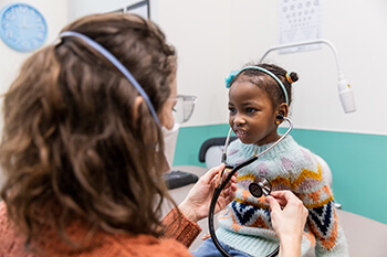 Patient being examined by provider