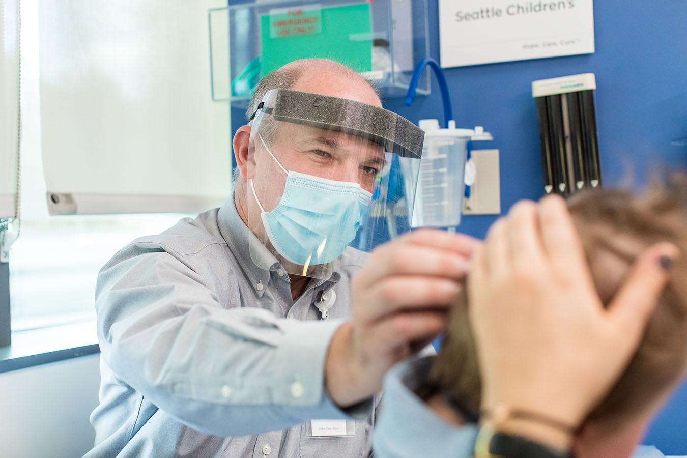 a doctor examines a patient