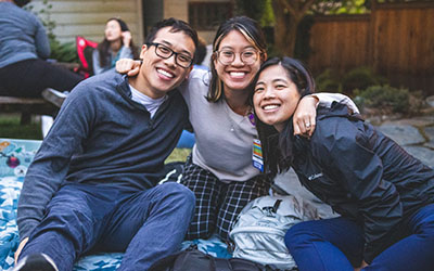 Three residents pose for the camera