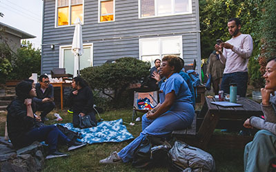 Resident chat in front of a house