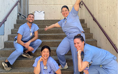 Residents pose on the stairs at UWMC