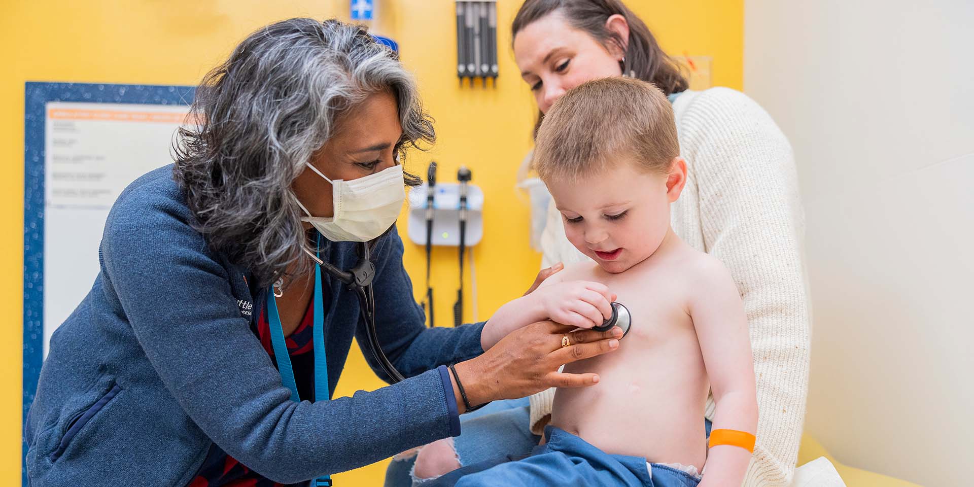 A Seattle Children's doctor examines a boy