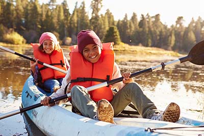 A boy and a girl in a kayak